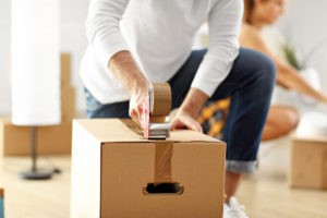 happy adult couple moving out new home