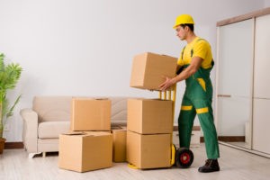 man delivering boxes during house move