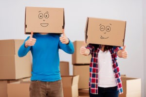 people with cardboard boxes heads